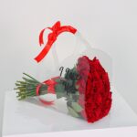 Arreglo de Rosas en Cartera Acrílica